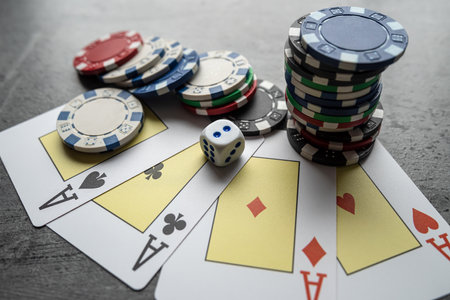 chips for poker with playing card on grey background, nobody. Poker game conceptの写真素材