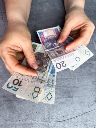 woman count 10 20 50 zl zloty pln. Financial concept. Payment