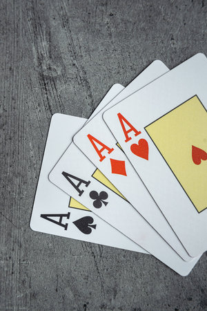 Four aces playing cards winner hand in casino. Gamling concept