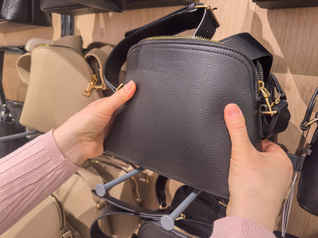 close up woman chooses bag at shop, shopping concept. New collectionの写真素材