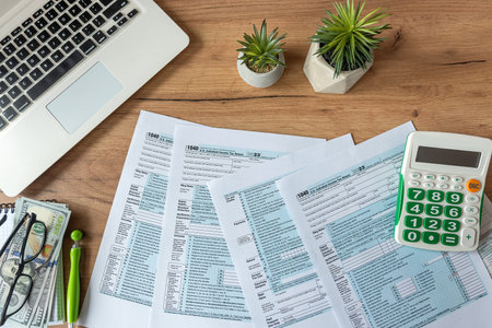 2024 Blank US Individual income tax return and a calculator business finance concept.の写真素材