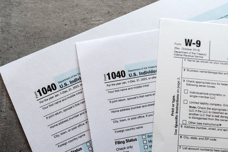 empty tax form blanks 1040 w9 W 9 federal income form as business concept. Time for taxの写真素材