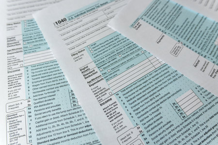 1040 blank tax form U.S. individual income return on desk. Deadline, tax seasonの写真素材
