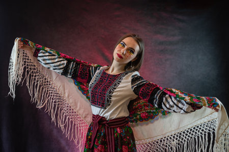 Portrait of young pretty woman wear ethnic clothes embroidered blouse or dress with handkerchief at studio shoot. National fashionの写真素材