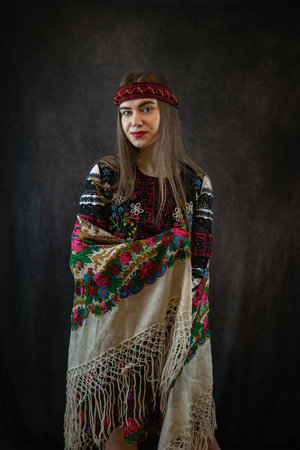 Beautiful ukrainian woman wear traditional ethnic clothes - embroidered shirts and handkerchief on...