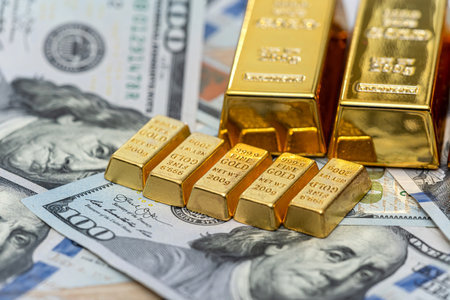 US paper dollars money with gold bars, financial saving background. Exchange rates and making money concept.の写真素材