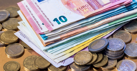 pile of Euro paper with metal coins, close up. EU economy and finance conceptの写真素材