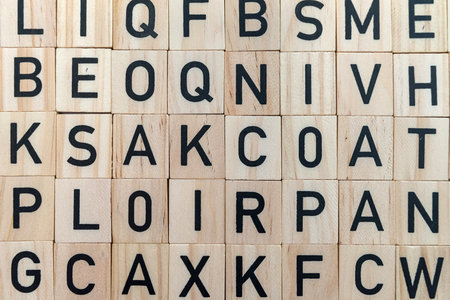 background from alphabets on a wooden surface. The concept of thinking development, grammar.