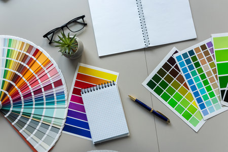 creative workplace color palette with notepad, brush. Modern graphic designer workspaceの写真素材