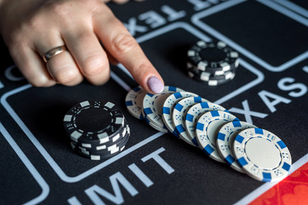 feman player makes a bet, and puts a chip at casino. Gambling concept. A chance to winの写真素材