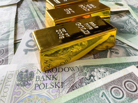 Gold bars with polish paper money or banknotes. Money and financial conceptの写真素材