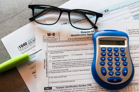 1040 Individual income tax return form blank with pen glasses calculator. Time to pay taxes