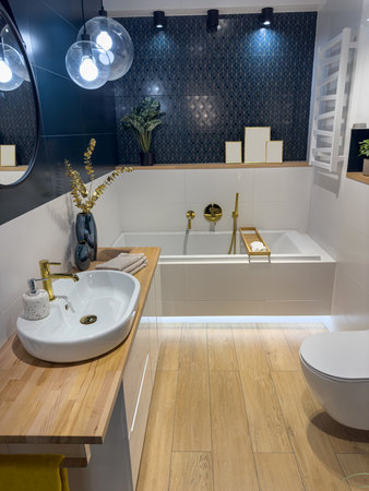 modern bathroom with bathtub and sleek tiles, accessories, sweet homeの写真素材