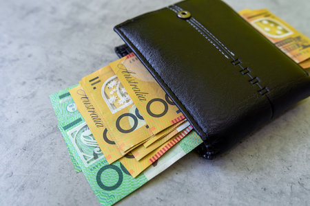 Australian Currency in a black wallet. Financial saving concept.の写真素材