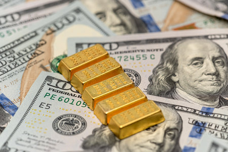group gold bars and paper dollar bills as financial background. Exchange or saving conceptの写真素材