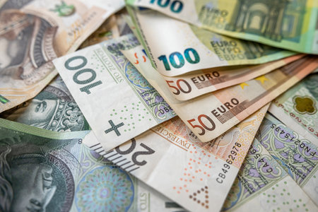 100 euro banknote with 100 200 PLN Polish zloty finance background. Concept of exchange rateの写真素材