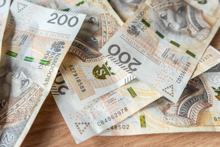 200 lot of polish zloty banknotes (PLN) on desk. Saving investment conceptの写真素材