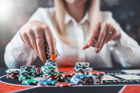 Pretty woman playing poker makes a bet with chips all in. Gambling conceptの写真素材