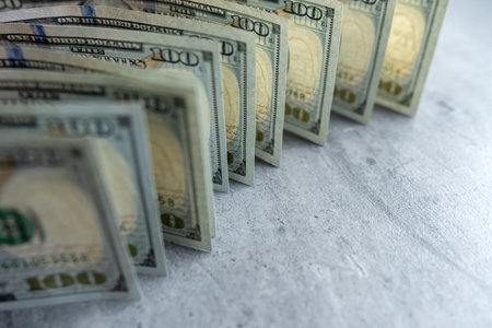 american money hundred dollar bills on grey desk. Financial conceptの写真素材