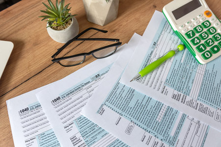 2024 Blank US Individual income tax return and a calculator business finance concept.の写真素材