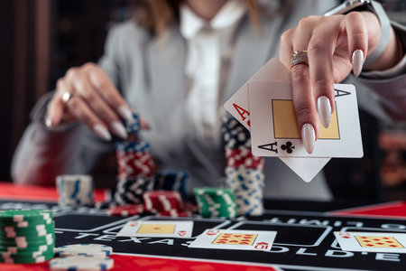Playing woman poker and gambling in casino, spending time in games of chance. Gambling night lifestyleの写真素材