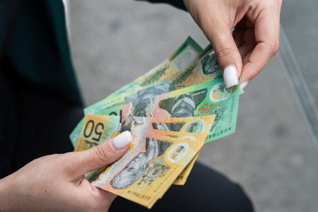 close up woman holding a lot of 50 1000 new aud australian dollar. Financial conceptの写真素材