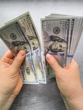 close up female hand counting money us dollar. Financial saving concept. Businessの写真素材