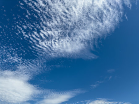 few white cloud on a blue sky. Nature as backgroundの写真素材
