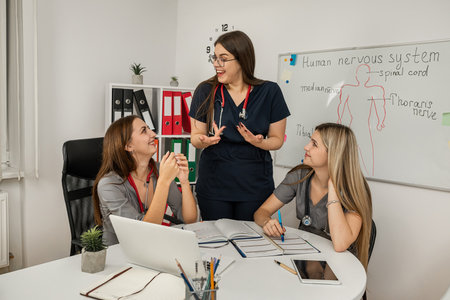 group of happy doctors hold a meeting and communicate at medical office. Concept of clinic workers consultingの写真素材