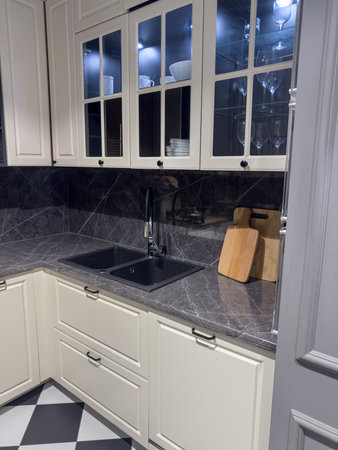 Modern kitchen interior in scandinavian style, with worktop, counters and ovenの写真素材