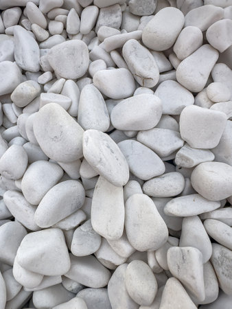 white small pebbles stone as background rock textureの写真素材