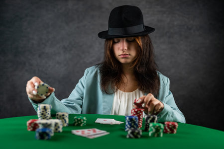 girl came to the night casino to play poker at a wide green table. a woman in a hat. poker game...