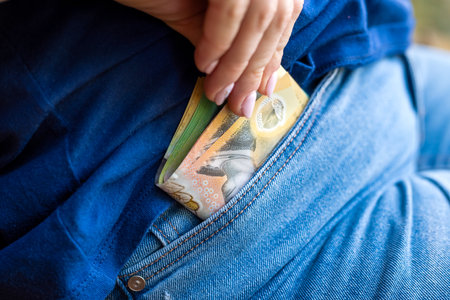 female hand hold new one hundreds and fifty Australian dollar AUD aussie money. Saving conceptの写真素材