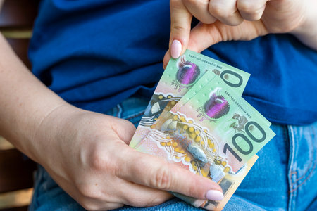 woman counting new 50 100 AUD Australian Dollars financial concept. Savingの写真素材