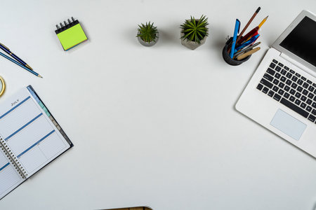 Top view of office workplace desk with laptop pen on notebook. Crative workの写真素材