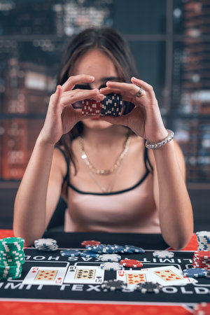 Pretty woman play poker and have a good time in casino, texas hold'em. Gambling conept