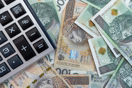 polish zloty money banknotes with calculator. 200 100 pln bills business concept aの写真素材