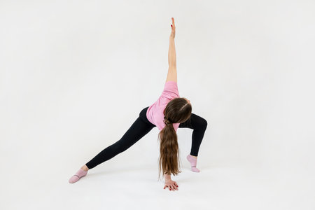young slim fitness trainer shows how to correctly perform stretching exercises isolated. Sport conceptの写真素材