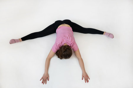 woman doing pilates workout at studio shot, gray background. Sport conceptの写真素材