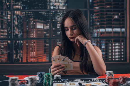 professional female player holding ace playing cards as win combination in poker game. Bet and money winningの写真素材