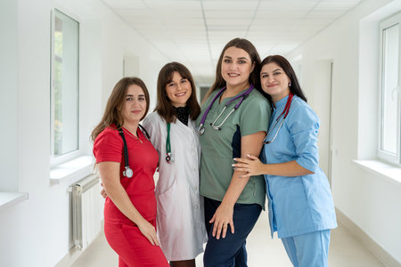 Group of happy caucasian intern students wear coat lab in college hallway. Medical worker, teamworksの写真素材