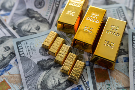 finance trading investment with gold bars or dollar paper money. Exchange or savingの写真素材