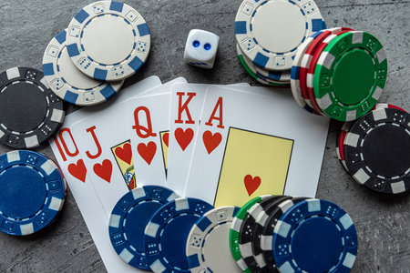 chips for poker with playing card on grey background, nobody. Poker game conceptの写真素材