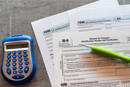 1040 TAX form blank on a calculator. Individual Income Tax Return. Accounting conceptの写真素材