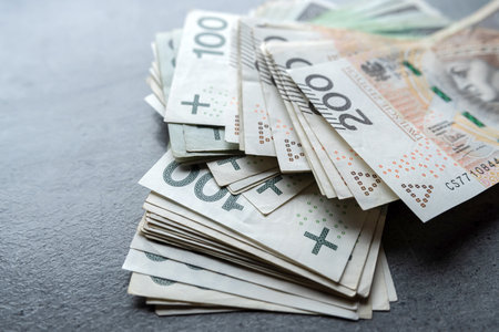 Top view 100 200 polish zloty banknotes with stack of money. PLnの写真素材