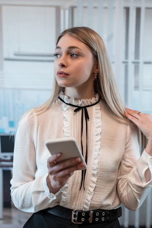 Young businesswoman use smart phone at office, Lunch Breakの写真素材