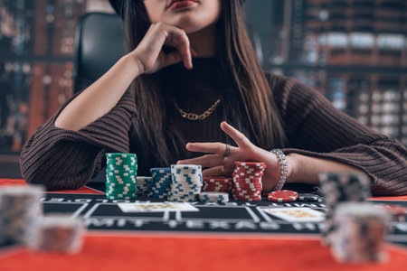 Woman playing in poker game ar casino. Poker room, lifestyleの写真素材