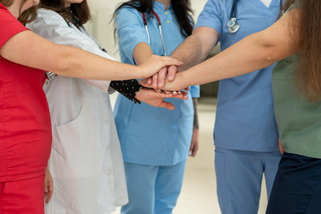 High five, doctors in a medical team stacking hands,  collaboration and support in a hospital. Motivation and victory conceptの写真素材