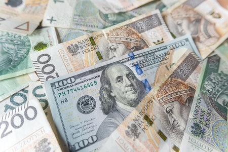 Polish zloty with us dollar cash as financial background. Saving or investment exchange conceptの写真素材