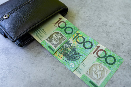 Aud Australian money in black male leather purse. Saving conceptの写真素材